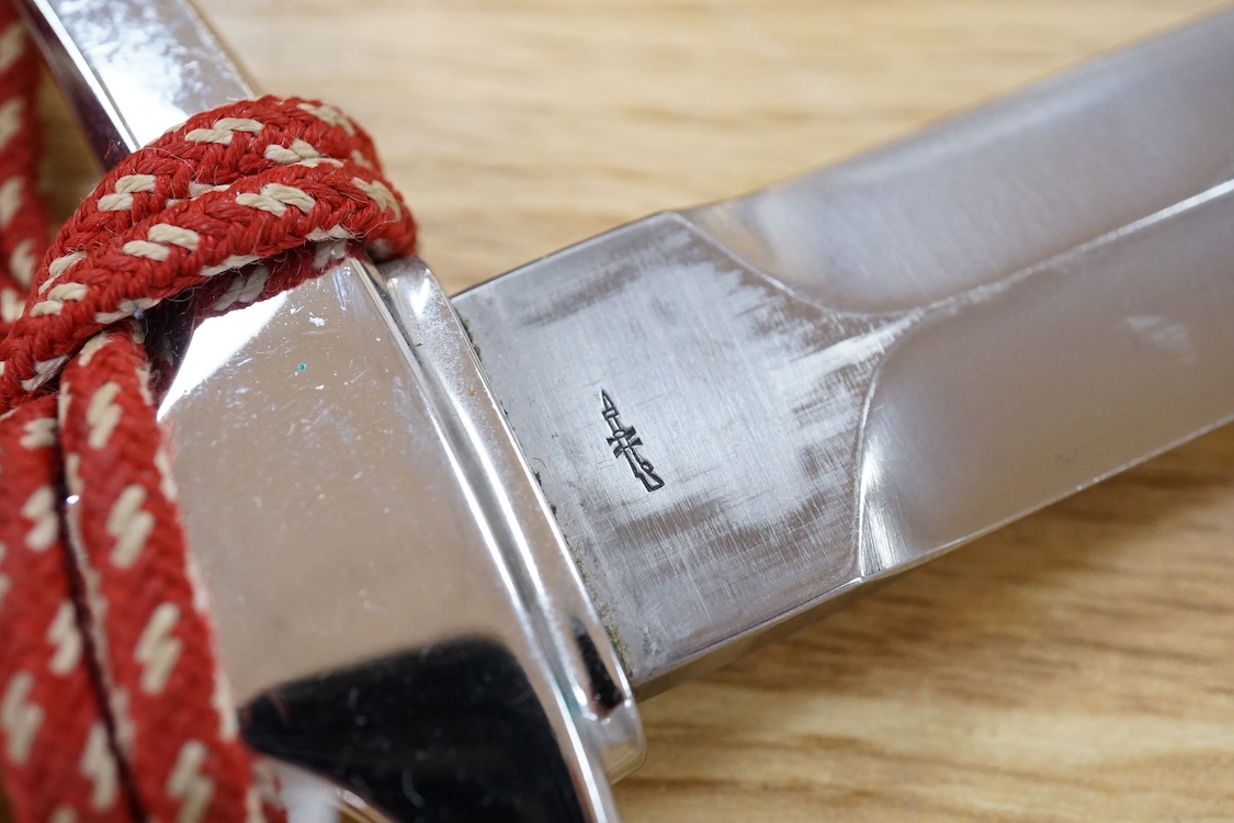 A post 1943 Swiss Army dagger, with knot and scabbard